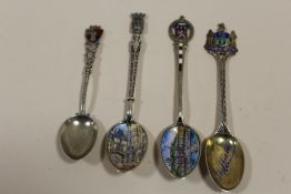 FOUR SILVER AND ENAMEL TEASPOONS