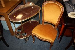 A VINTAGE SERVING/DRINKS TROLLEY TOGETHER WITH AN UPHOLSTERED BEDROOM CHAIR (2)