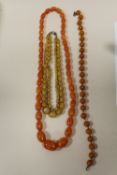 THREE VINTAGE AMBER STYLE BEAD NECKLACES