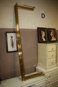 A LARGE MODERN BRASS EFFECT FENDER, W 182 cm