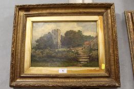 AN ANTIQUE GILT FRAMED OIL ON CANVAS OF A CHURCH AND HOUSE SCENE SIGNED LOWER RIGHT