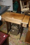 A VINTAGE OAK SINGER TREADLE SEWING MACHINE