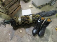 A PAIR OF STEEL TOE CAP BOOTS TOGETHER WITH CAMOUFLAGE NETTING