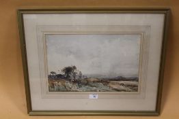 A GILT FRAMED AND GLAZED WATERCOLOUR OF A COUNTRY LANDSCAPE INDISTINCTLY SIGNED LOWER LEFT