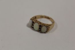 A HALLMARKED 9 CARAT ROSE GOLD OPAL AND SAPPHIRE DRESS RING