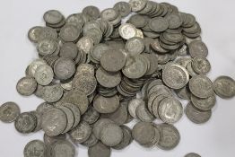 A QUANTITY OF ONE AND TWO SHILLING COINS