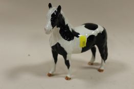 A BESWICK PIEBALD PONY FIGURE