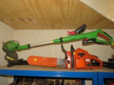 A HUSQVARNA CHAINSAW TOGETHER WITH A CORDLESS STRIMMER