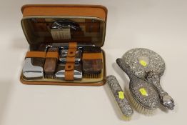 A MATCHED HALLMARKED SILVER DRESSING TABLE SET TOGETHER WITH BOXED BRUSH SET