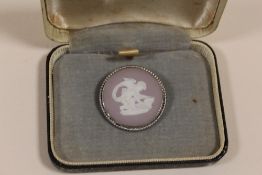 A WEDGWOOD JASPERWARE BROOCH WITH SILVER MOUNT