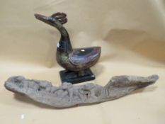 A LARGE INDONESIAN CARVED WOODEN DUCK TOGETHER WITH A BURMESE STYLE TEAK WOODEN ELEPHANT CARVING