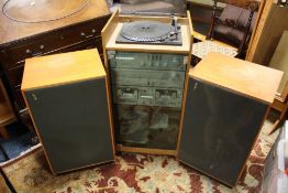 A RETRO AMSTRAD HI-FI SYSTEM WITH RECORD DECK WITH A PAIR OF RETRO TEAK RICHARD ALLEN SPEAKERS
