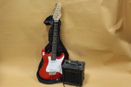 A RED ROCKET MUSIC ELECTRIC GUITAR WITH CARRY BAG AND BURSWOOD G10 AMPLIFIER