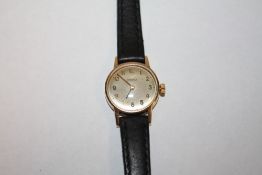A LADIES 9CT GOLD CASED OMEGA WRISTWATCH