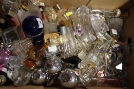 A TRAY OF EMPTY PERFUME BOTTLES