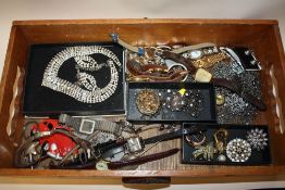 A WOODEN TRAY OF COSTUME JEWELLERY AND WRISTWATCHES ETC.