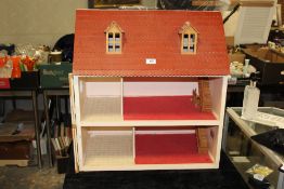 A VINTAGE WOODEN DOLLS HOUSE