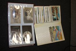 TWO ALBUMS OF VINTAGE AND ANTIQUE POSTCARDS
