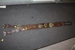 A LONG LEATHER MARTINGALE OF HORSE BRASSES