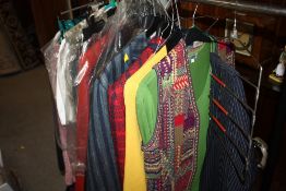 A RAIL OF LADIES AND GENTS VINTAGE AND MODERN CLOTHING