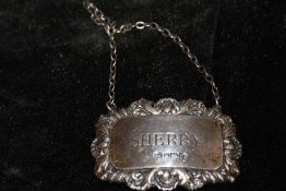 A HALLMARKED SILVER SHERRY DECANTER LABEL