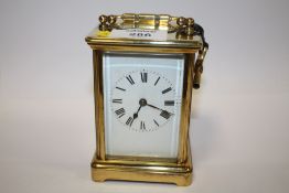 AN ANTIQUE FRENCH BRASS 8 DAY STRIKING MOVEMENT CARRIAGE CLOCK