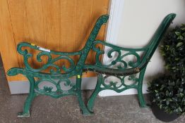 TWO CAST PAINTED GREEN BENCH ENDS