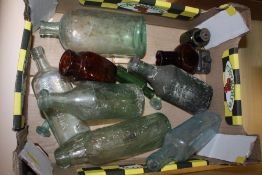 A TRAY OF VINTAGE GLASS BOTTLES