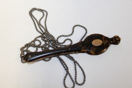 A PAIR OF VICTORIAN YELLOW METAL AND TORTOISESHELL SPRUNG FOLDING LORGNETTES, with attached white