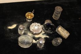 A COLLECTION OF SILVER TOPPED CRUETS ETC