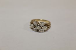 A HALLMARKED 9 CARAT GOLD SEVEN STONE DRESS RING SIZE N APPROX WEIGHT - 3.9G