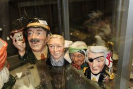 A LARGE ROYAL DOULTON 'THE COLLECTOR' CHARACTER JUG, TOGETHER WITH THREE SMALLER CHARACTER JUGS TO