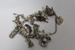 A HALLMARKED SILVER CHARM BRACELET