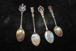 FOUR SILVER AND ENAMEL TEASPOONS
