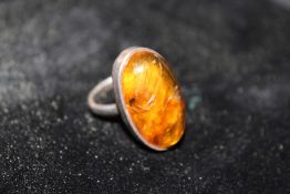 AN WHITE METAL AND AMBER DRESS RING