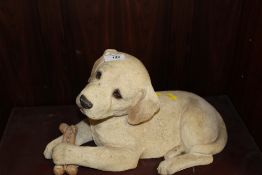 A SANDICAST FIRESIDE TYPE FIGURE OF A GOLDEN LABRADOR PUPPY