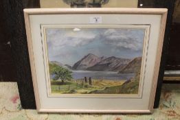 A FRAMED AND GLAZED WATERCOLOUR OF A MOUNTAINOUS LAKE SCENE SIGNED MURIEL DEXTER