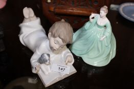 A NAO FIGURE OF A BOY READING A BOOK, TOGETHER WITH A COALPORT LADY FIGURE