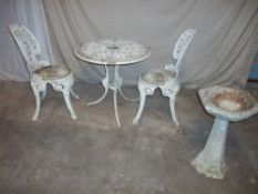 AN ALUMINIUM TWO CHAIR PATIO SET AND A CONCRETE BIRDBATH