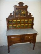 AN ANTIQUE EDWARDIAN STYLE WASH STAND WITH TILED BACK