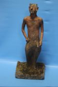AN ANTIQUE TERRACOTTA FIGURE OF PAN SET INTO LATER CONCRETE BASE