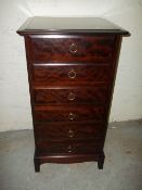 A STAG MINSTREL SIX DRAWER NARROW CHEST OF DRAWERS