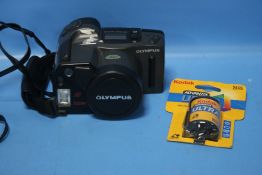 AN OLYMPUS AZ-300 SUPER ZOOM CAMERA IN CASE WITH A NEW FILM
