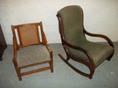 A ROCKING CHAIR AND AN OAK FRAMED CHAIR