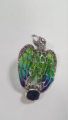 A SILVER EAGLE BROOCH / PENDANT SET WITH A SAPPHIRE, RUBY EYE, COLOURED ENAMEL AND MARCASITES