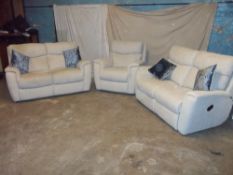 A FABRIC THREE PIECE SUITE COMPRISING TWO TWO SEATER SOFAS AND A CHAIR
