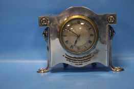 AN ANTIQUE EPNS CASED EIGHT-DAY MANTEL CLOCK