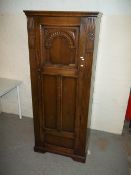 AN ANTIQUE HEAVILY CARVED HALL WARDROBE