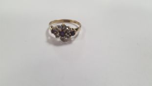 A LADIES 9 CT GOLD DRESS RING SET WITH CZS AND PURPLE STONES