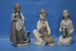 TWO NAO FIGURES AND A LLADRO FIGURE WITH PUPPY (3)